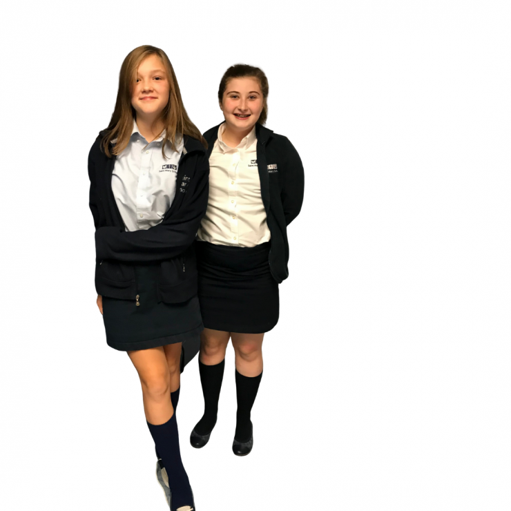 Two middle school girls in fall uniforms
