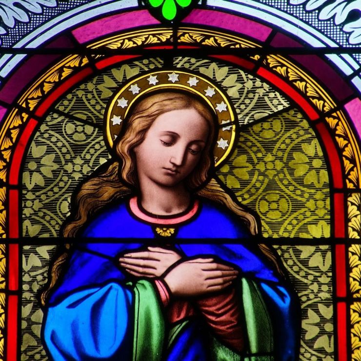 Beautiful image of a stained glass window featuring Mary